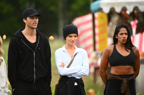 Rob Rausch and Maura Higgins competing in The Traitors.